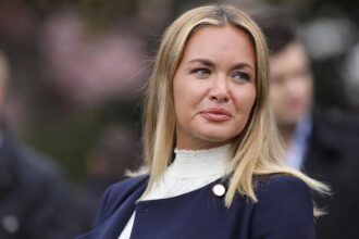 Vanessa Trump smiling at one of her events while greeting those in attendance.