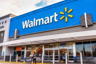 One of the Walmart stores viewed from the front with its iconic yellow and blue colors.