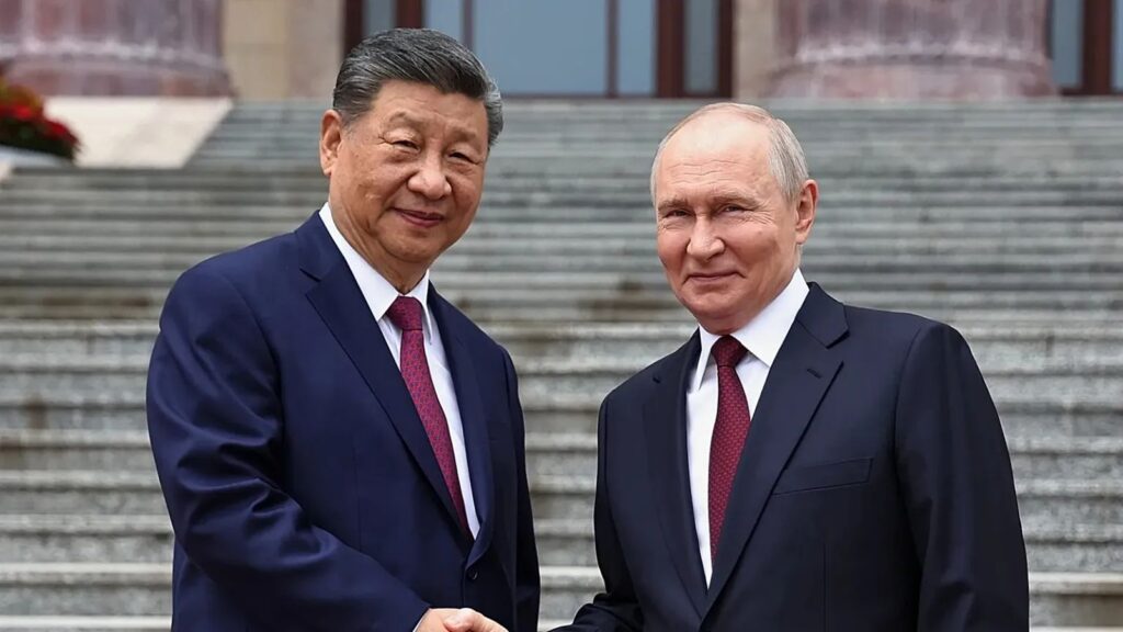 The top leaders of China and Russia shaking hands in public in front of numerous news outlets