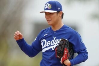 Yoshinobu Yamamoto preparing on the mound to throw one of his pitches.