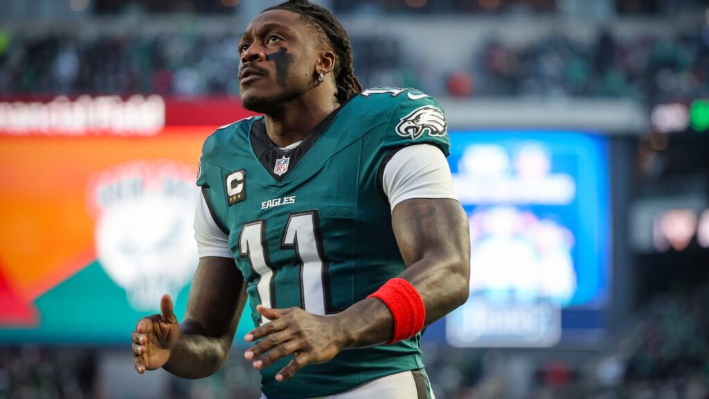 The electrifying player wearing the Eagles uniform while warming up before the game