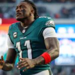The electrifying player wearing the Eagles uniform while warming up before the game