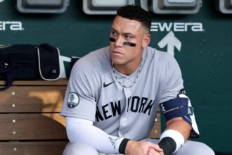 The New York team’s star sitting on the bench with a concerned expression on his face