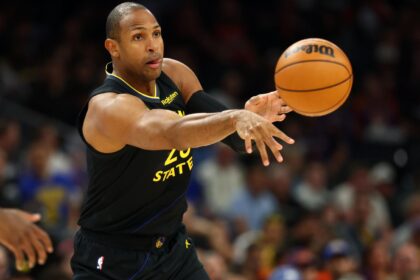 The veteran basketball player throwing the ball for a pass during one of the games