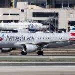 An American Airlines aircraft taxiing toward the runway at a slow speed before takeoff