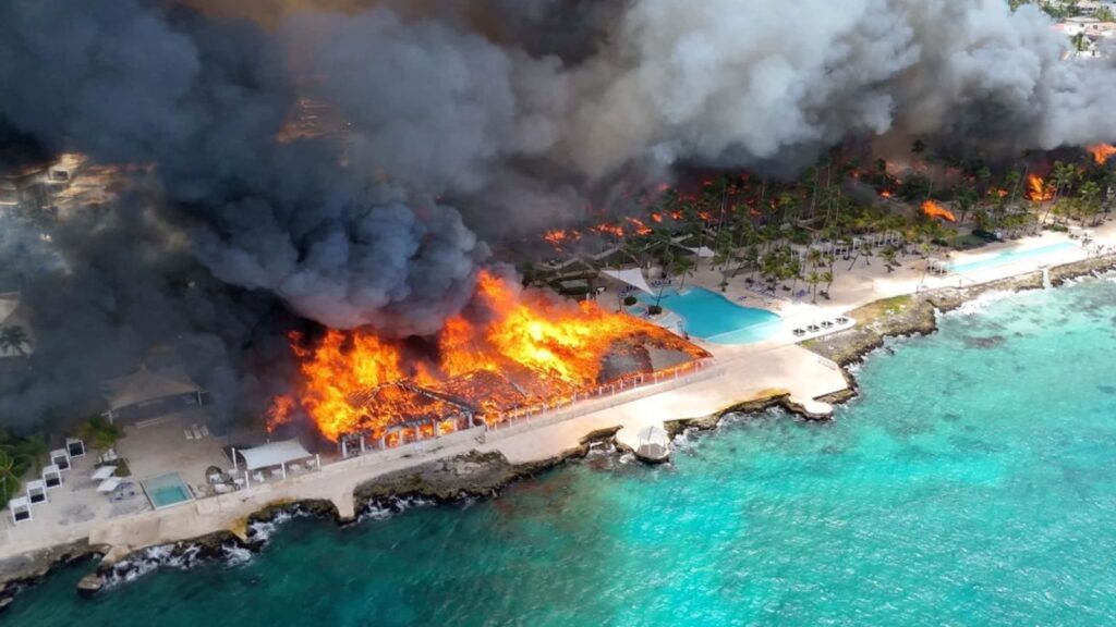Aerial view of the hotel engulfed in flames from the sky