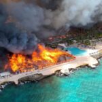 Aerial view of the hotel engulfed in flames from the sky