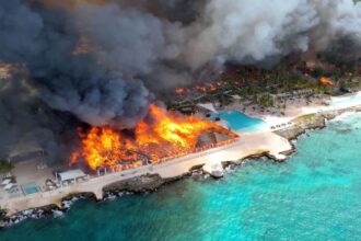 Aerial view of the hotel engulfed in flames from the sky