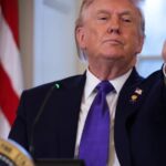 The President of the United States pointing a finger at the camera with a very serious expression