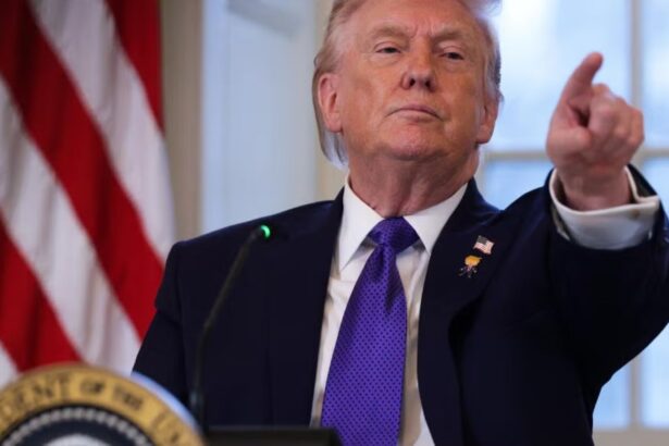 The President of the United States pointing a finger at the camera with a very serious expression
