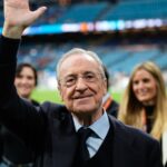 Florentino waving to Real Madrid fans from the pitch after a victory