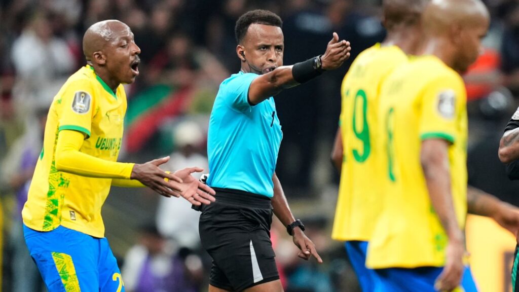 From deportation to the spotlight: Somali referee set to officiate the UEFA Super Cup The Somali referee blowing the whistle for a foul against a team in yellow, whose players are protesting his decision