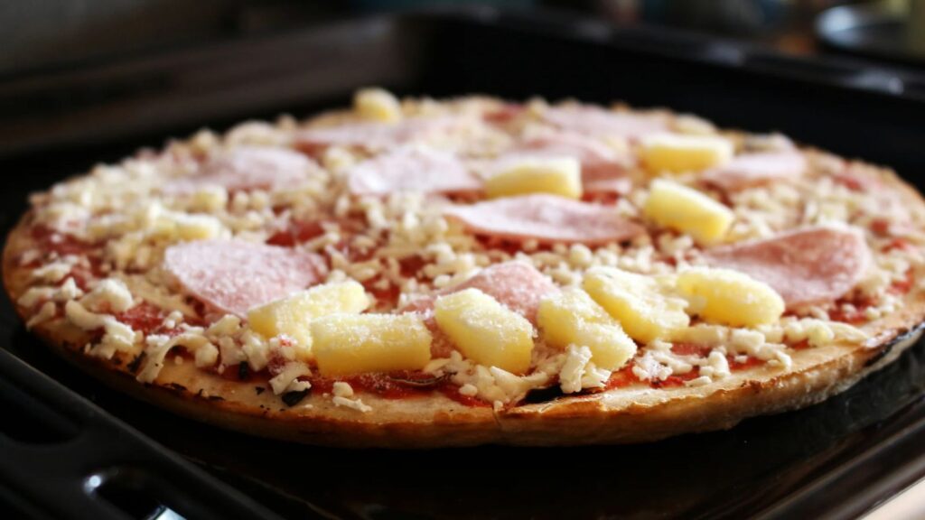 Frozen pizzas recalled from Walmart and Costco over possible contamination A frozen Hawaiian pizza being placed into an oven for baking