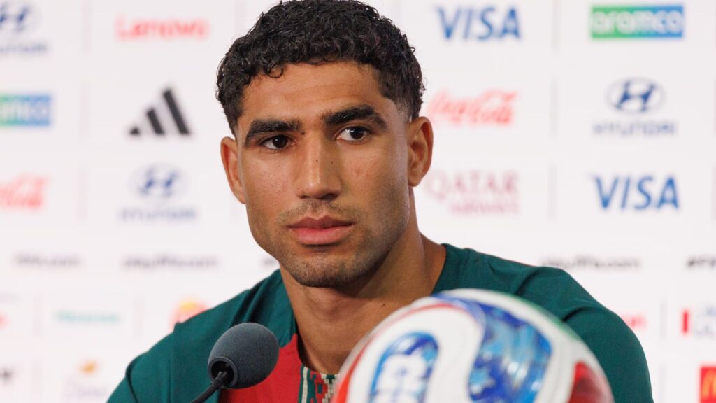 The Moroccan player staring intently at a point during a press conference while listening to journalists