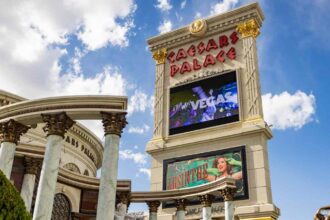 A panoramic image of the giant sign of the luxurious and eye-catching Caesars Palace hotel in Las Vegas