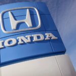 The Honda logo displayed on a blue and white wall