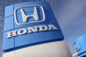 The Honda logo displayed on a blue and white wall