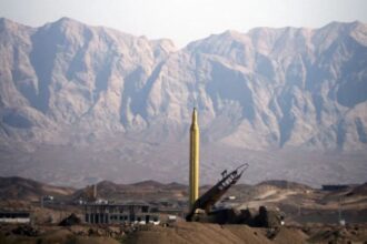 A vehicle carrying a large missile that is about to be launched