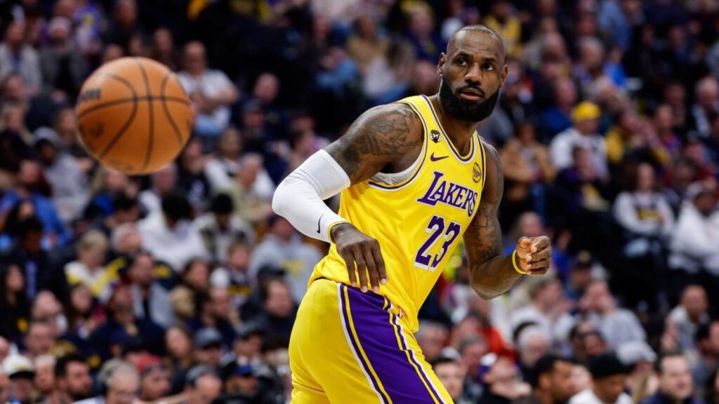 LeBron James shocks the NBA by leaving the Lakers and entering free agency LeBron passing the ball to a teammate during a game