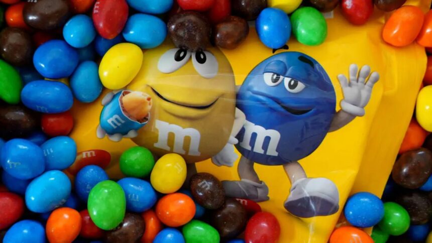 The typical logo of the candy company surrounded by many of its own products