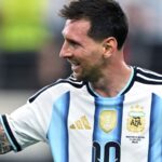 Messi celebrating with a clenched fist after scoring his two goals against the Austrian national team