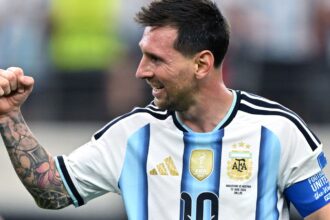 Messi celebrating with a clenched fist after scoring his two goals against the Austrian national team
