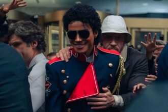 Michael Jackson surrounded by several members of his security team while leaving a stage