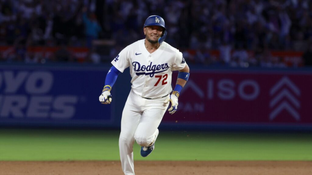 Miguel Rojas comes through off the bench and lifts the Dodgers with a key home run Rojas running around the bases after hitting a home run that secured the victory for his team