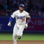 Rojas running around the bases after hitting a home run that secured the victory for his team