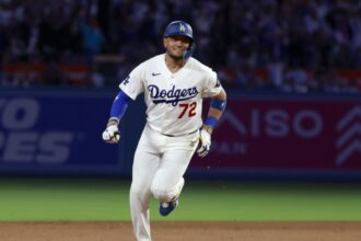 Rojas running around the bases after hitting a home run that secured the victory for his team