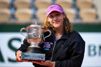 The Russian tennis player holding her trophy after an epic victory