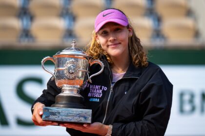 The Russian tennis player holding her trophy after an epic victory