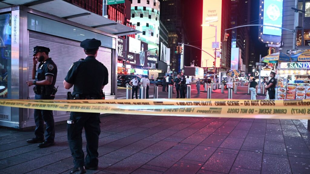 Moments of panic in Times Square after reports of gnfire and a rapid police response Several police officers cordoning off an area of Times Square following a firearm-related incident