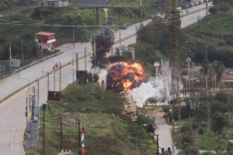 A bridge being destroyed by a massive explosion