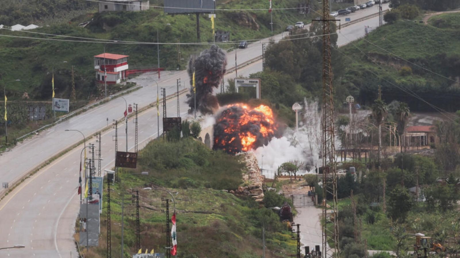 A bridge being destroyed by a massive explosion