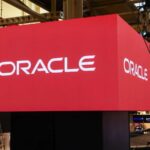 Several screens projecting the Oracle name with a red background and black letters