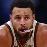 Curry chewing on his mouthguard while waiting for the ball to take a free throw