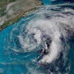 An image showing a massive storm approaching one side of the United States