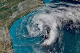 An image showing a massive storm approaching one side of the United States