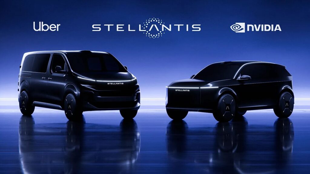 Two black high-tech cars being showcased as the next generation of smart Uber vehicles