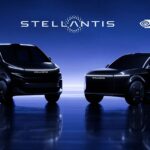 Two black high-tech cars being showcased as the next generation of smart Uber vehicles