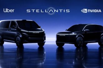 Two black high-tech cars being showcased as the next generation of smart Uber vehicles