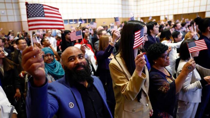 A group of immigrants raising United States flags during a protest against their rights