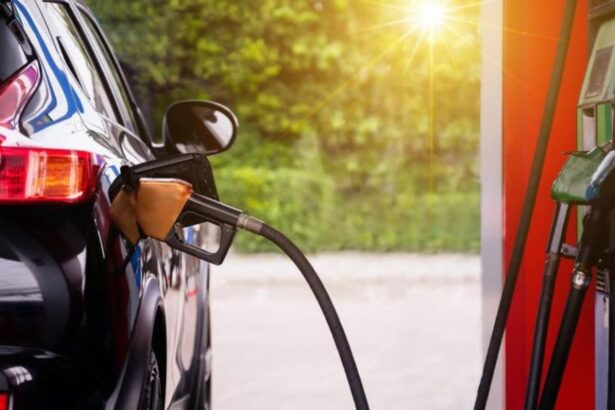 A car being refueled at a gas station with sky-high fuel prices