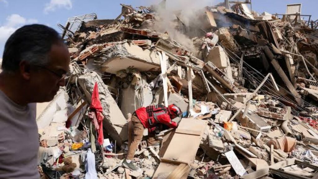 Several people carrying out search-and-rescue operations for survivors following the powerful earthquake in Venezuela