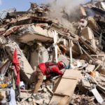 Several people carrying out search-and-rescue operations for survivors following the powerful earthquake in Venezuela
