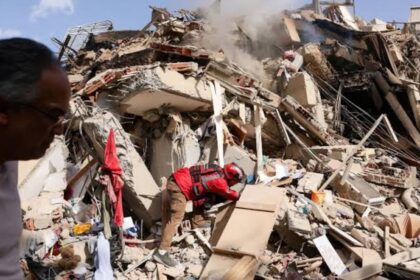 Several people carrying out search-and-rescue operations for survivors following the powerful earthquake in Venezuela