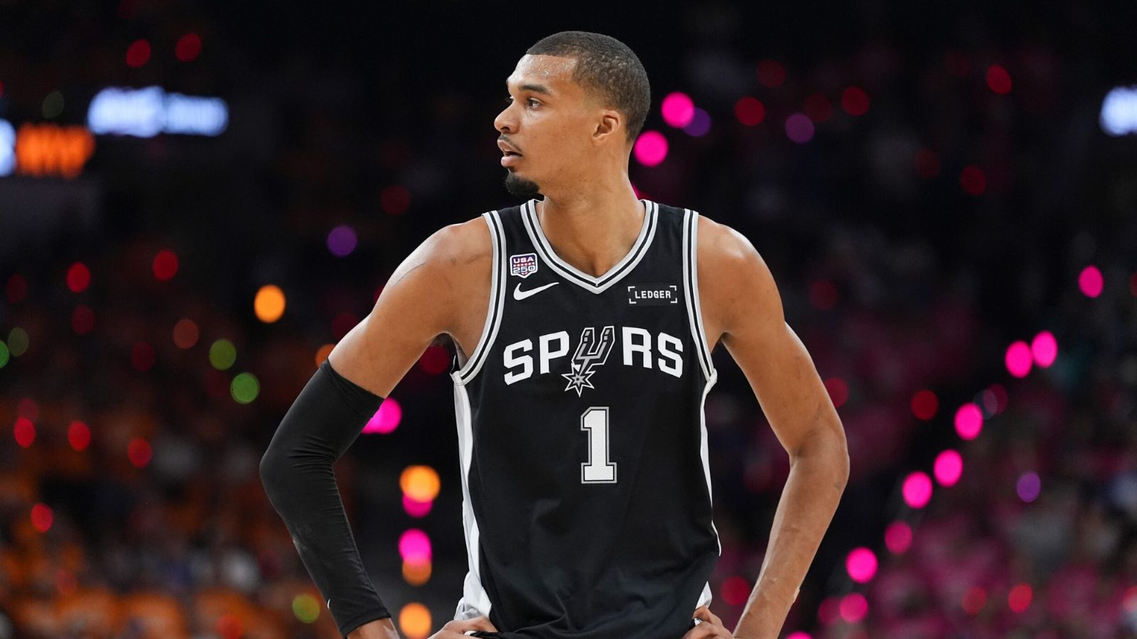 The French superstar standing with his hands on his hips, radiating pride after defeating the Knicks