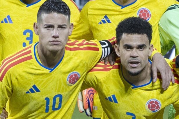 The two Colombian stars hugging each other for the team photo before the start of a match