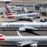 Air travel chaos in the United States: Computer system failure grounds American Airlines flights Several American Airlines aircraft parked at an airport awaiting further instructions